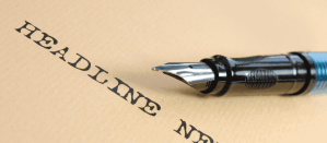 Vulpen op beige papier met het woord "Headline" in grote, donkere letters.
