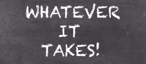Tekst op zwart bord met de woorden "Whatever It Takes!" in witte letters.